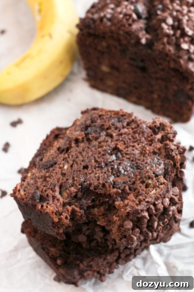 A top-down view of Double Chocolate Avocado Banana Bread with visible mini chocolate chips