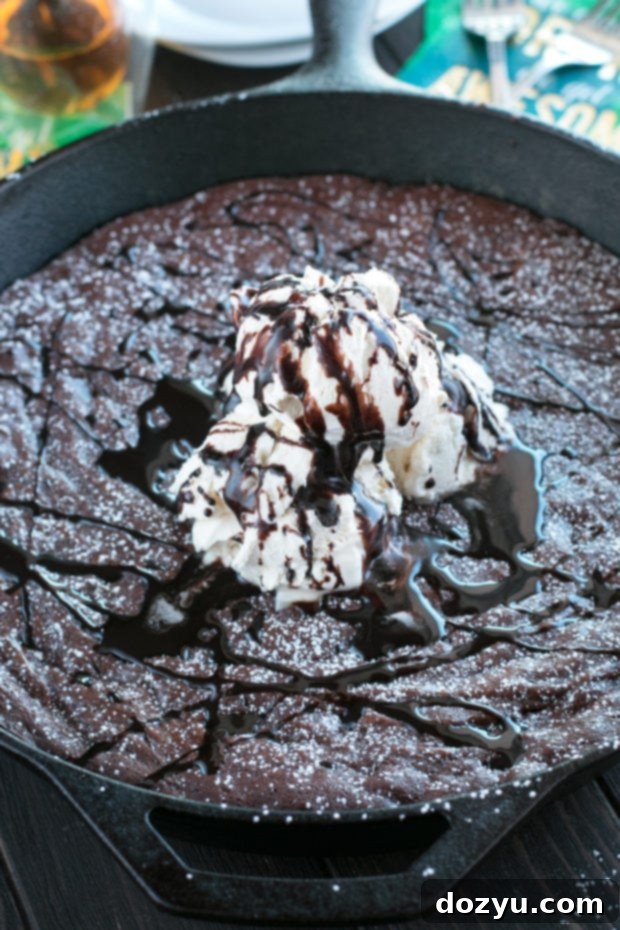 Gooey Whiskey Skillet Brownie with melted dark chocolate and Irish whiskey