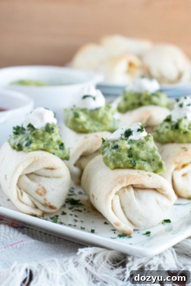 Mini Chimichangas cooling on a rack, freshly baked to a golden crisp