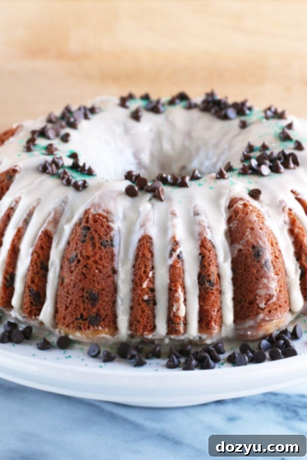 A slice of Bailey's Chocolate Chip Bundt Cake ready to be served, showcasing its interior.