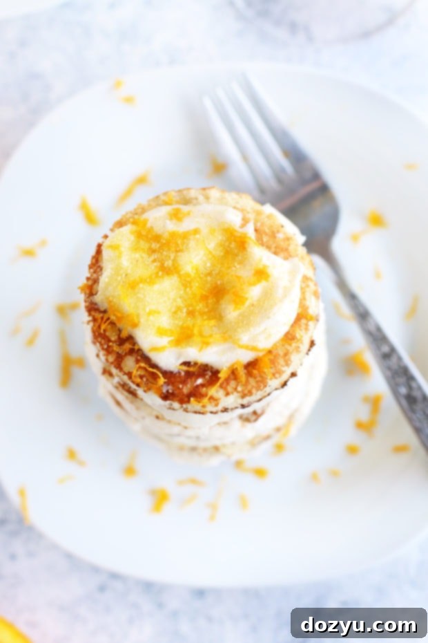 Close-up of Mimosa Pancake Stacks, showcasing the frosting layers