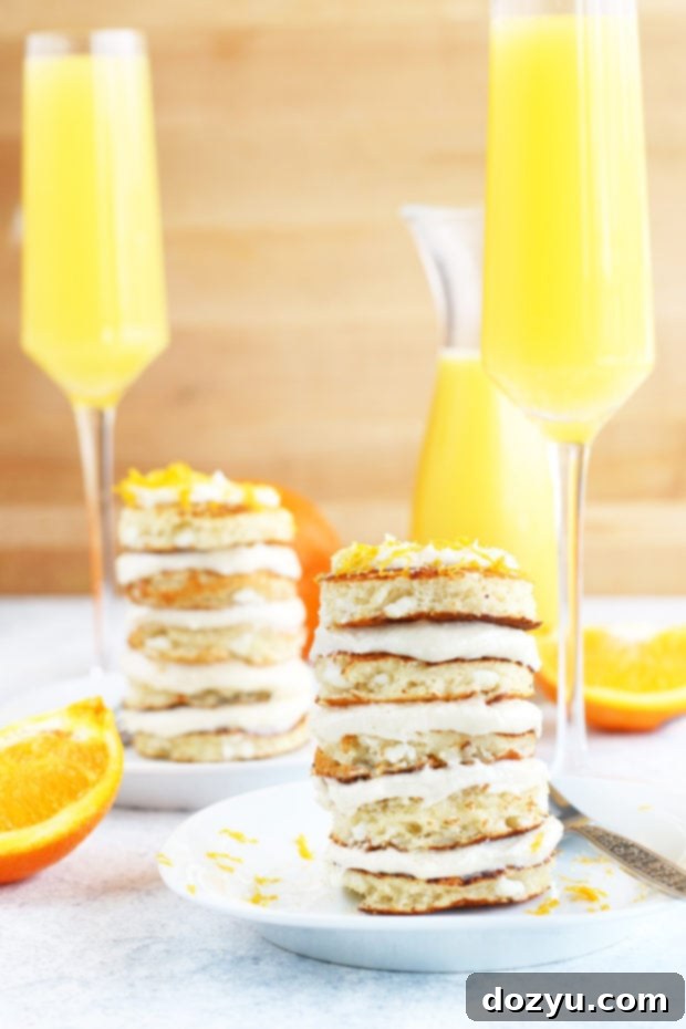 Side view of Mimosa Pancake Stacks with frosting peeking out