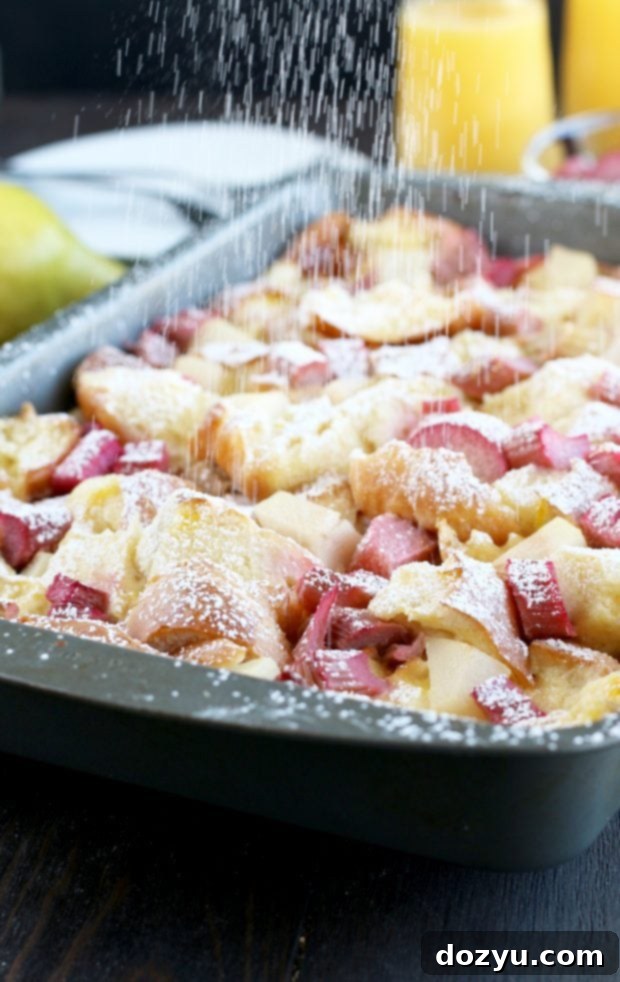 Delicious Rhubarb Pear French Toast Overnight Casserole with powdered sugar