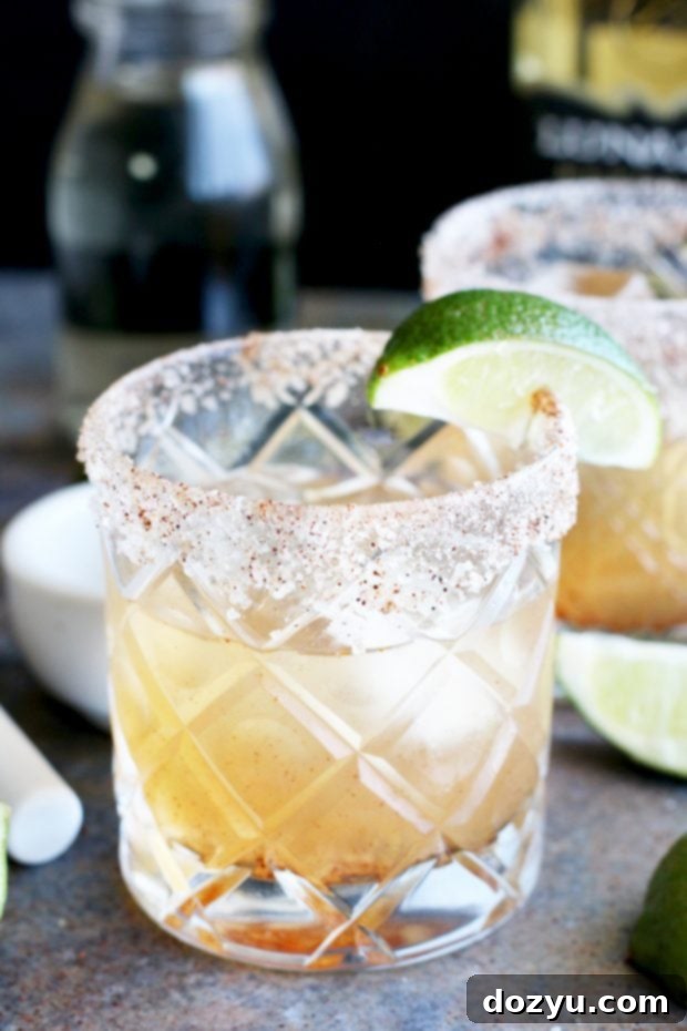 Blazing Ember Margarita 3 Close-up of Smoky Jalapeño Margarita with ice and garnish