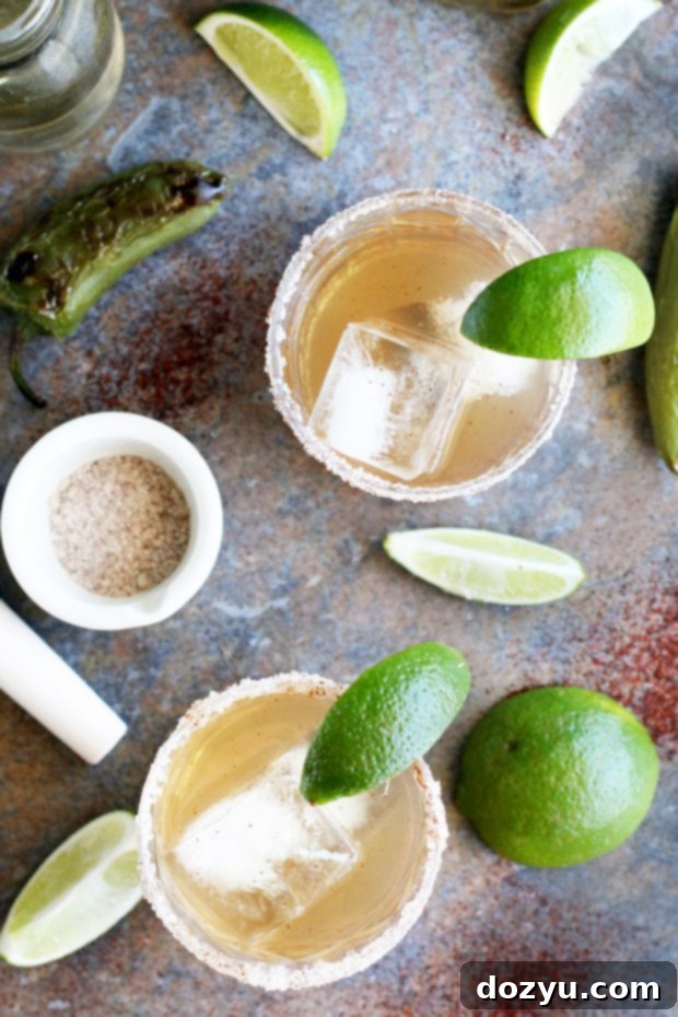 Blazing Ember Margarita 5 Refreshing Smoky Jalapeño Margaritas with a lime wedge garnish