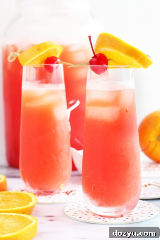 Side photo of glasses of big batch bubbly cocktail with tequila