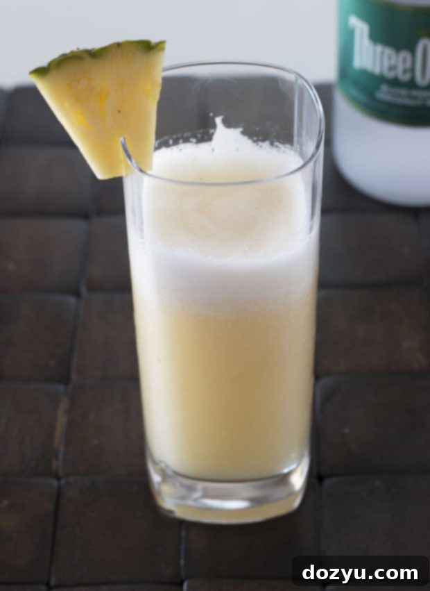 A frothy, frozen Pina Colada inspired cocktail, the 'Shake, Rattle & Roll', ready to be enjoyed.