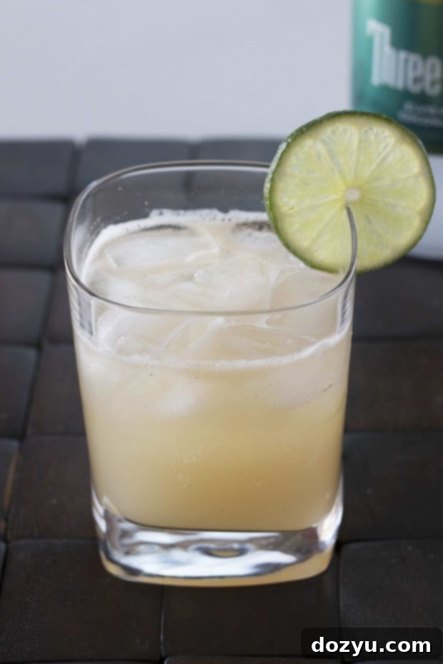 Sun-Kissed Serenity Sipper 2 Tropical Bliss Cocktail, a refreshing mix of guava and coconut vodka.