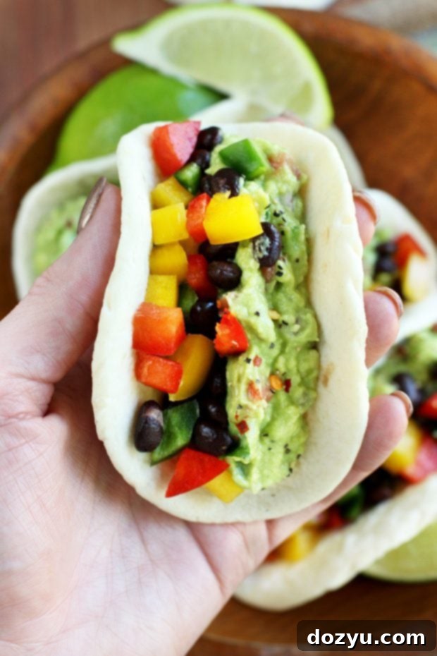 Close-up of a bowl of creamy guacamole ready for tacos