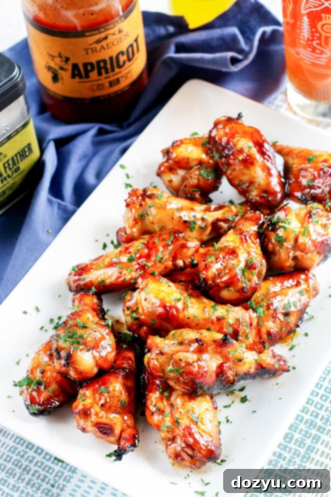 A vibrant platter of easy grilled beer marinated wings, perfectly charred and garnished with fresh green herbs.