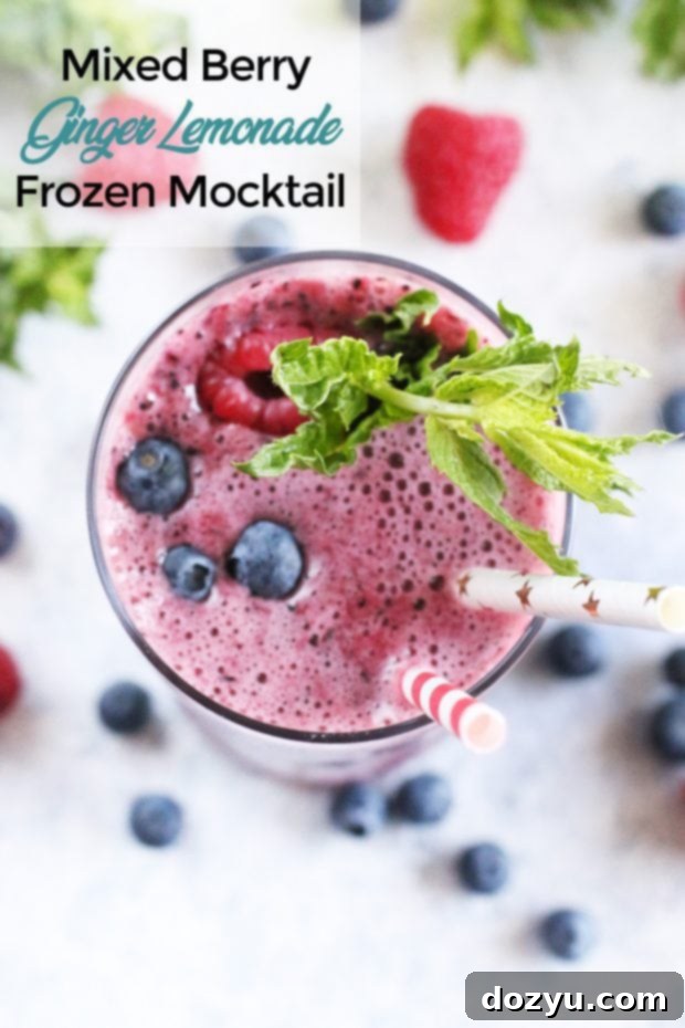 A Pinterest-friendly image for the Mixed Berry Ginger Lemonade Frozen Mocktail recipe.