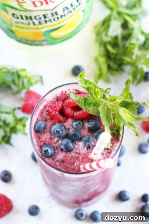 Another perspective of the refreshing frozen mocktail, highlighting its texture and fruit garnish.