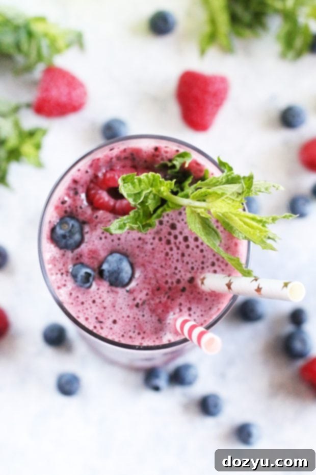 Bottles of Canada Dry Ginger Ale and Lemonade with fresh berries and mint.