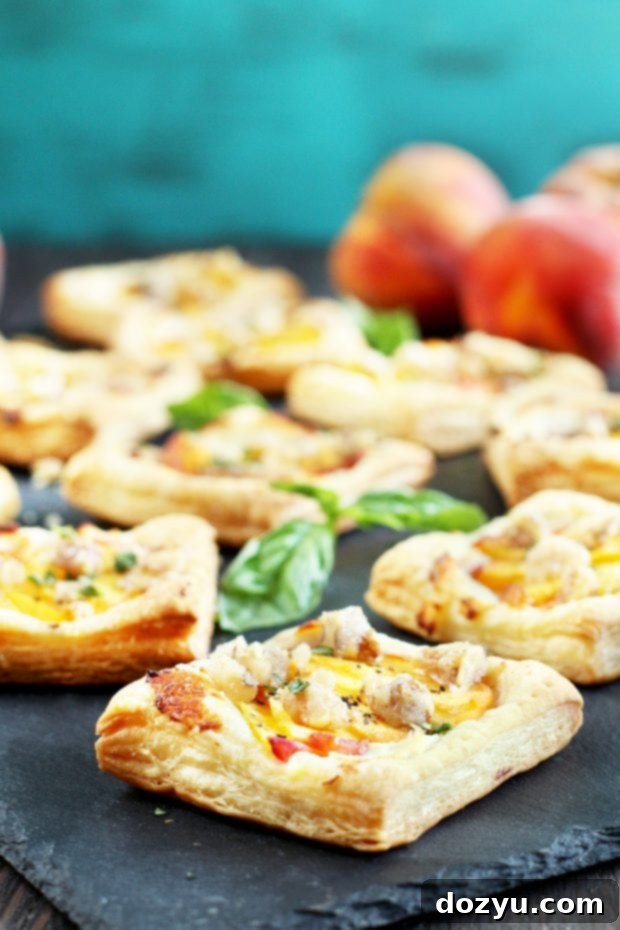 Fresh Peach Basil Goat Cheese Tarts 5 Hand holding a Peach Basil Goat Cheese Tart