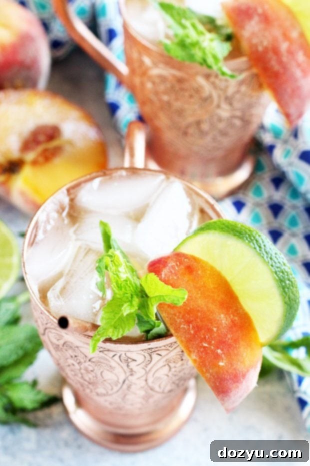 Chilled Peach Mint Moscow Mule in a copper mug