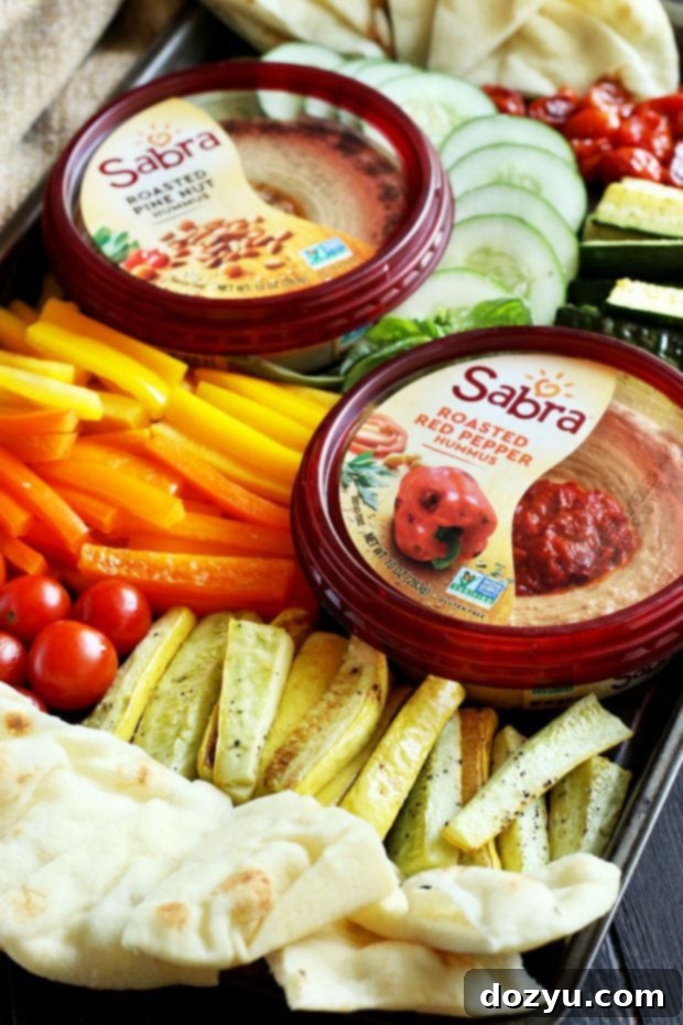 Summer Garden Veggie Hummus Platter 7 Close-up of a colourful vegetable hummus board with pita