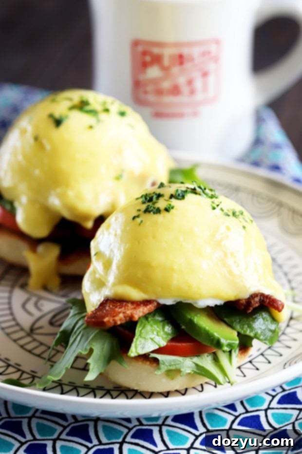 BLAT Eggs Benedict, an extraordinary brunch dish with bacon, lettuce, avocado, tomato, poached egg, and hollandaise.