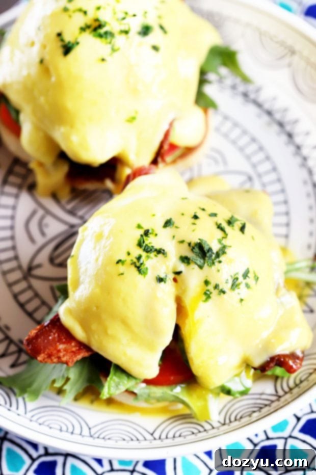 A delicious BLAT Eggs Benedict, featuring a perfectly poached egg and fresh ingredients, ready for brunch.