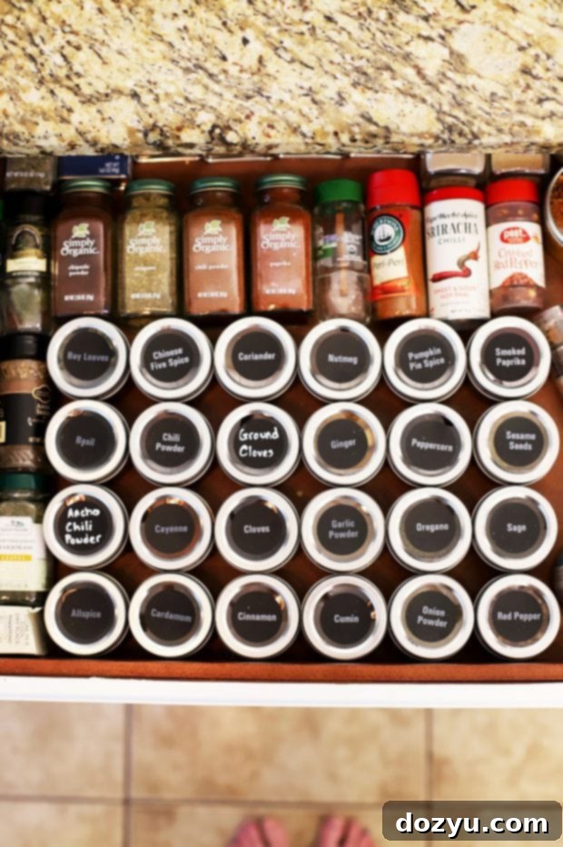 Organized spice drawer with magnetic spice tins and labels after decluttering