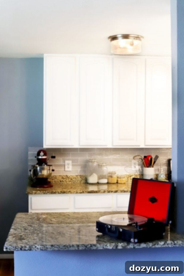 Clean and cleared kitchen counters after organization, with minimal items