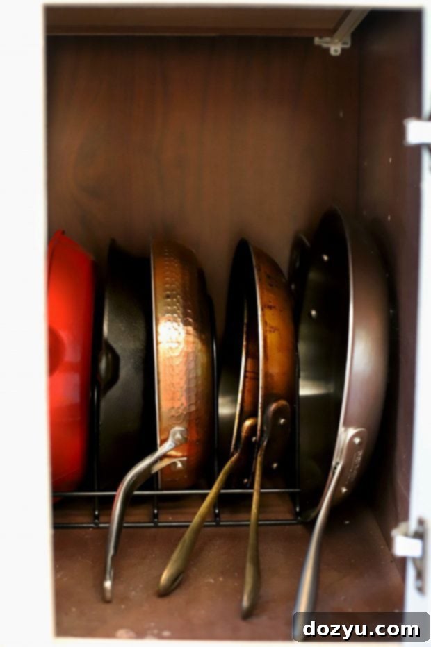 Various kitchen organization tools like tiered shelves and drawer organizers