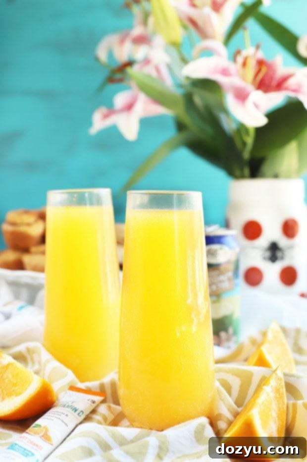 Tropical Mimosa Mocktail - a non-alcoholic refreshing drink with orange and pineapple