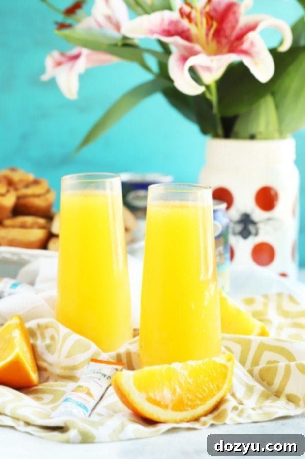 Ingredients being poured into a Tropical Mimosa Mocktail