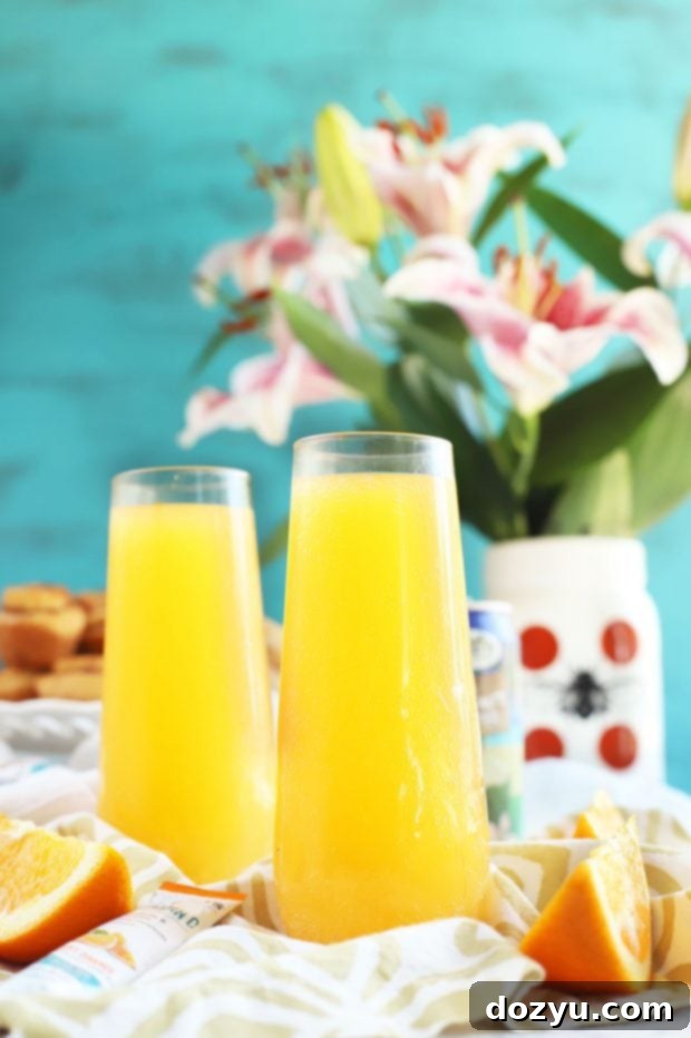 Another view of the Tropical Mimosa Mocktail glasses with fruit garnish