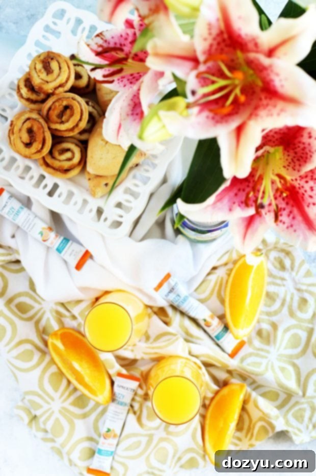 Two glasses of Tropical Mimosa Mocktail with focus on the bubbly texture