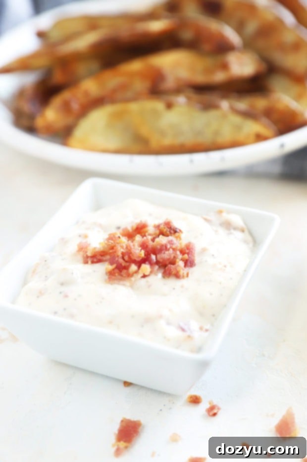 Smoky Bacon Aioli 4 Side view of a bowl of creamy bacon aioli.