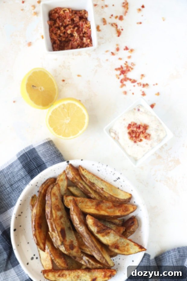 Smoky Bacon Aioli 5 Overhead image of crispy French fries being dipped in a bowl of bacon aioli.