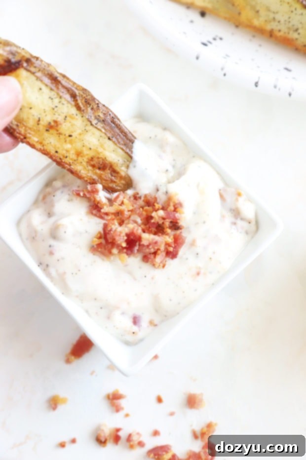 Smoky Bacon Aioli 8 Bacon Aioli in a bowl with a fry being dipped