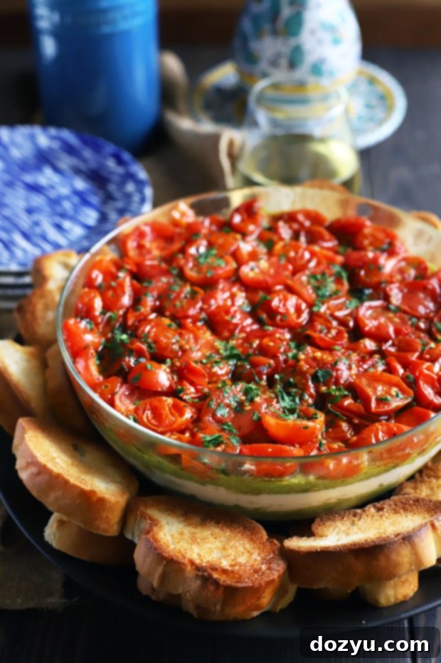 Avocado Ricotta Tomato Pesto Layer Dip with toasted baguette slices
