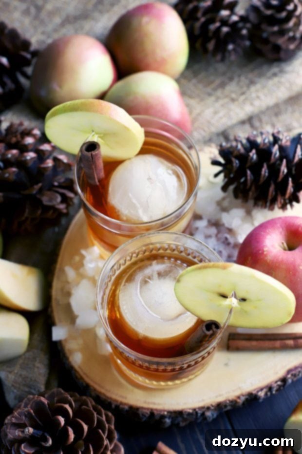 Apple Pie Old Fashioned Cocktail 4 Apple Pie Old Fashioned Cocktail garnished with an apple slice and cinnamon stick