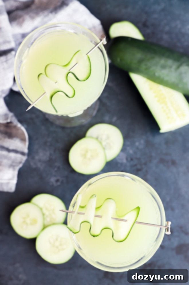 cucumber martinis in coupe glasses with cucumber garnish
