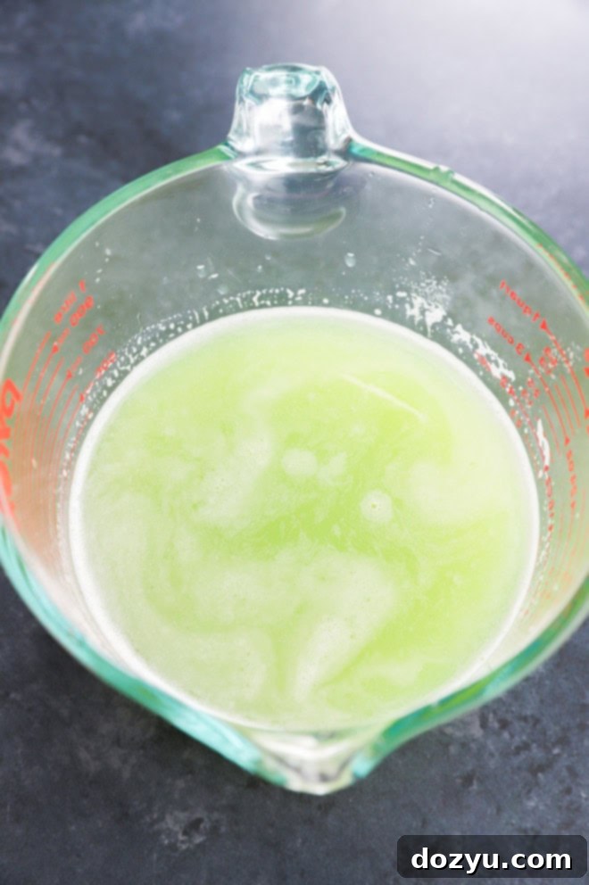 fresh cucumber juice in a pyrex measuring cup