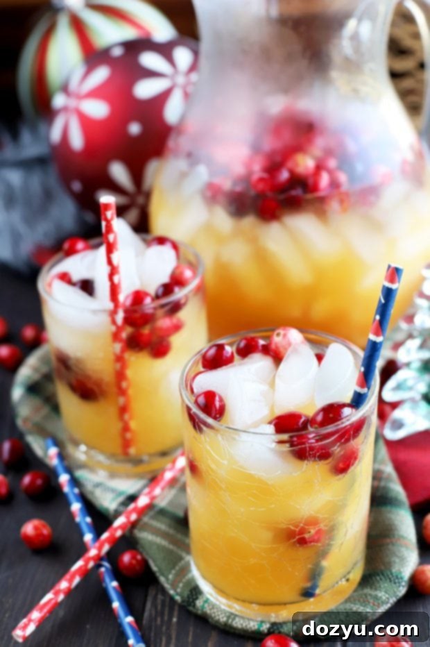 Spiced Tropical Holiday Champagne Punch, perfect for holiday gatherings