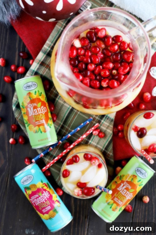 Champagne punch with tropical fruits and spices