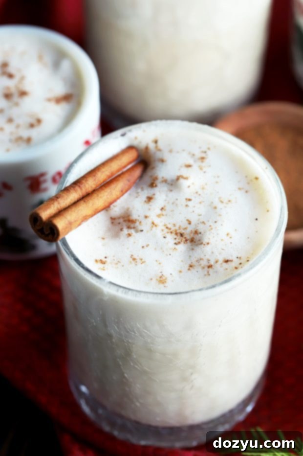 The Best Homemade Eggnog with a festive cinnamon stick