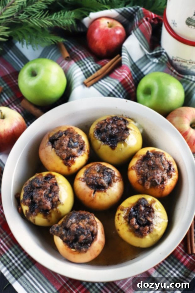 Two Stuffed Baked Apples in a bowl, ready to be enjoyed