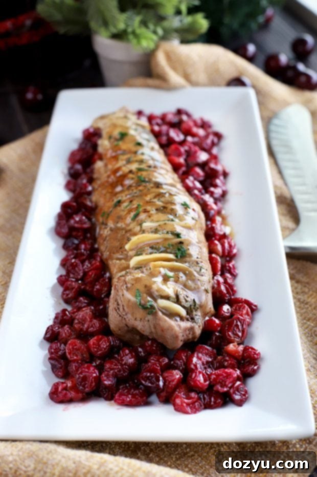 Hands preparing the hasselback pork tenderloin with Wüsthof knife