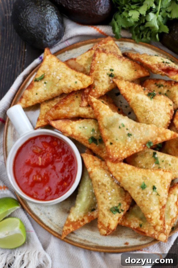 Guacamole Wontons piled on a white plate