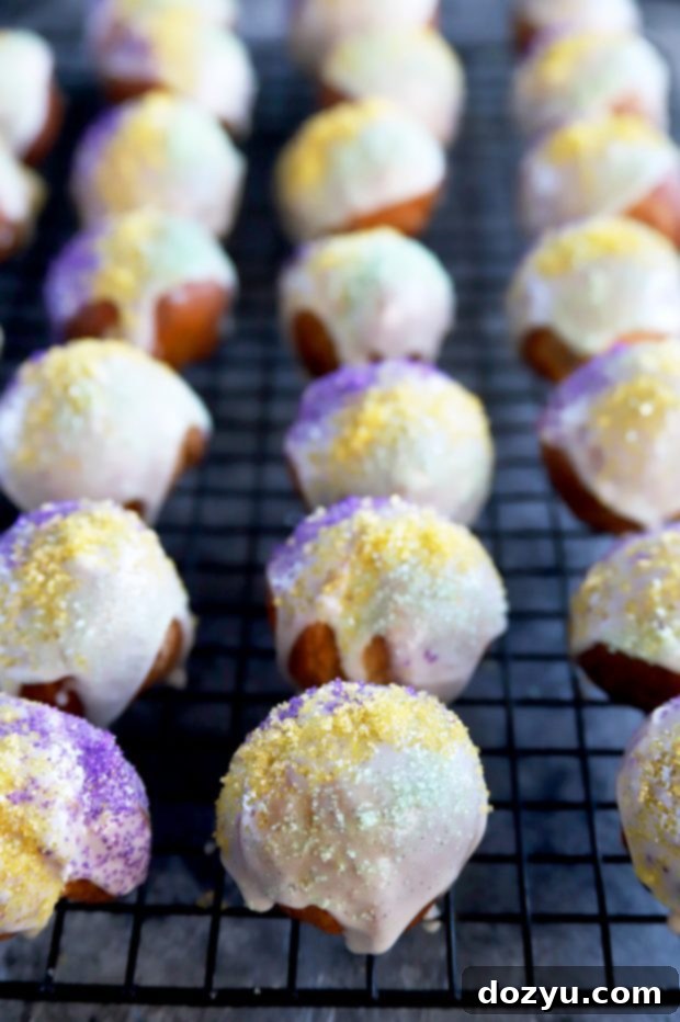 Vanilla bean iced King Cake Donut Holes with sprinkles