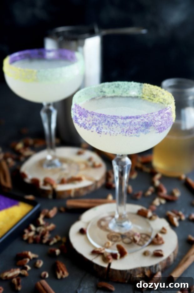 King Cake Daiquiri, a festive cocktail with green, yellow, and purple sugar rim, perfect for Mardi Gras celebrations.