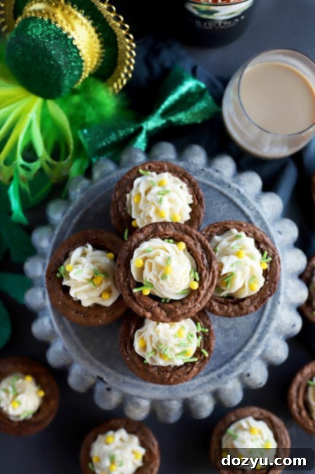 Espresso Brownie Cups With Bailey's Buttercream Frosting with green sprinkles
