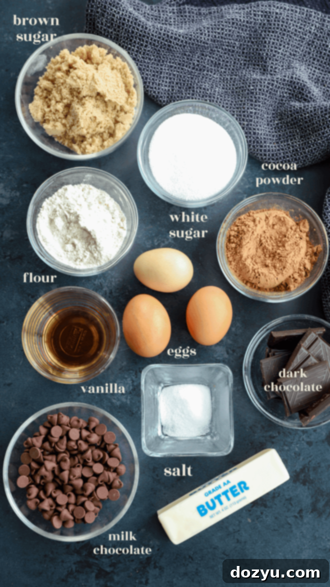 A vibrant flat lay image showcasing all the fresh ingredients required to make triple chocolate brownies, neatly arranged on a white surface with ingredient labels.