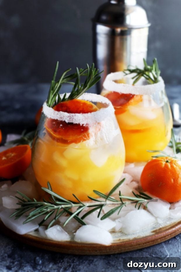 Two Clementine Mezcal Margaritas on a tray, ready to serve