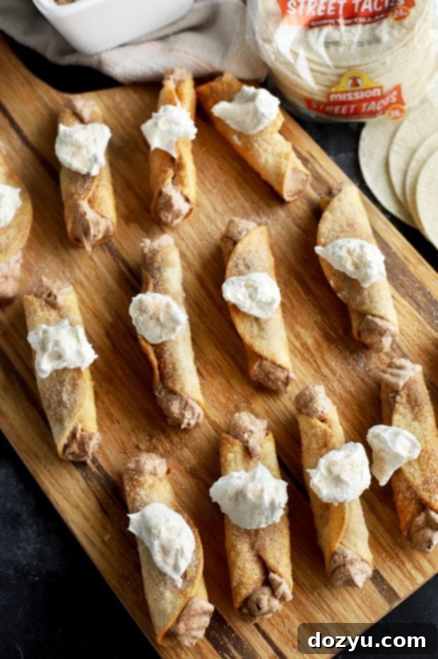 Churro Cheesecake Taquitos - Cinnamon-spiced crunchy, creamy dessert perfect for Cinco de Mayo parties. Made with Mission Street Tacos Corn Tortillas.