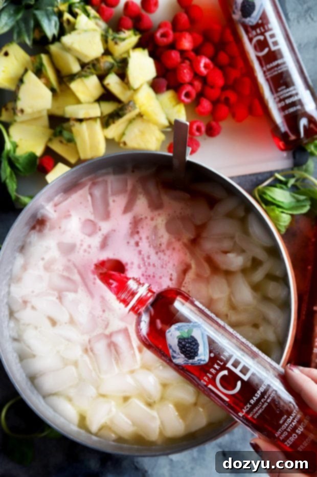 Pouring Black Raspberry Sparkling ICE Into the Sherbet Punch
