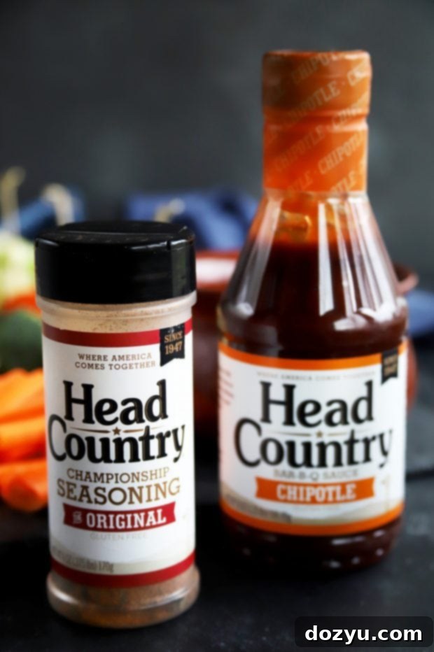 Chipotle Fondue Short Ribs 7 Head Country High Plains Heat Seasoning bottle next to the BBQ cheese fondue, indicating its use for an extra burst of spicy flavor.